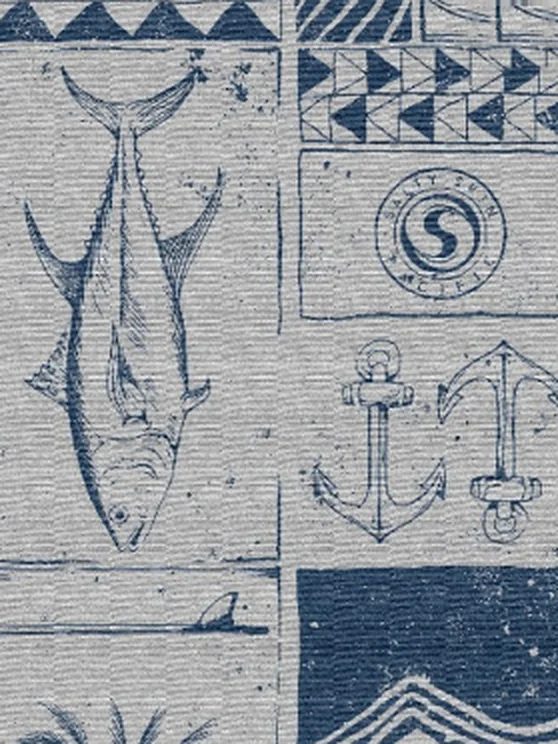 Navy woodcut-style repeating pattern of a tuna, an anchor and island motifs on textured fabric